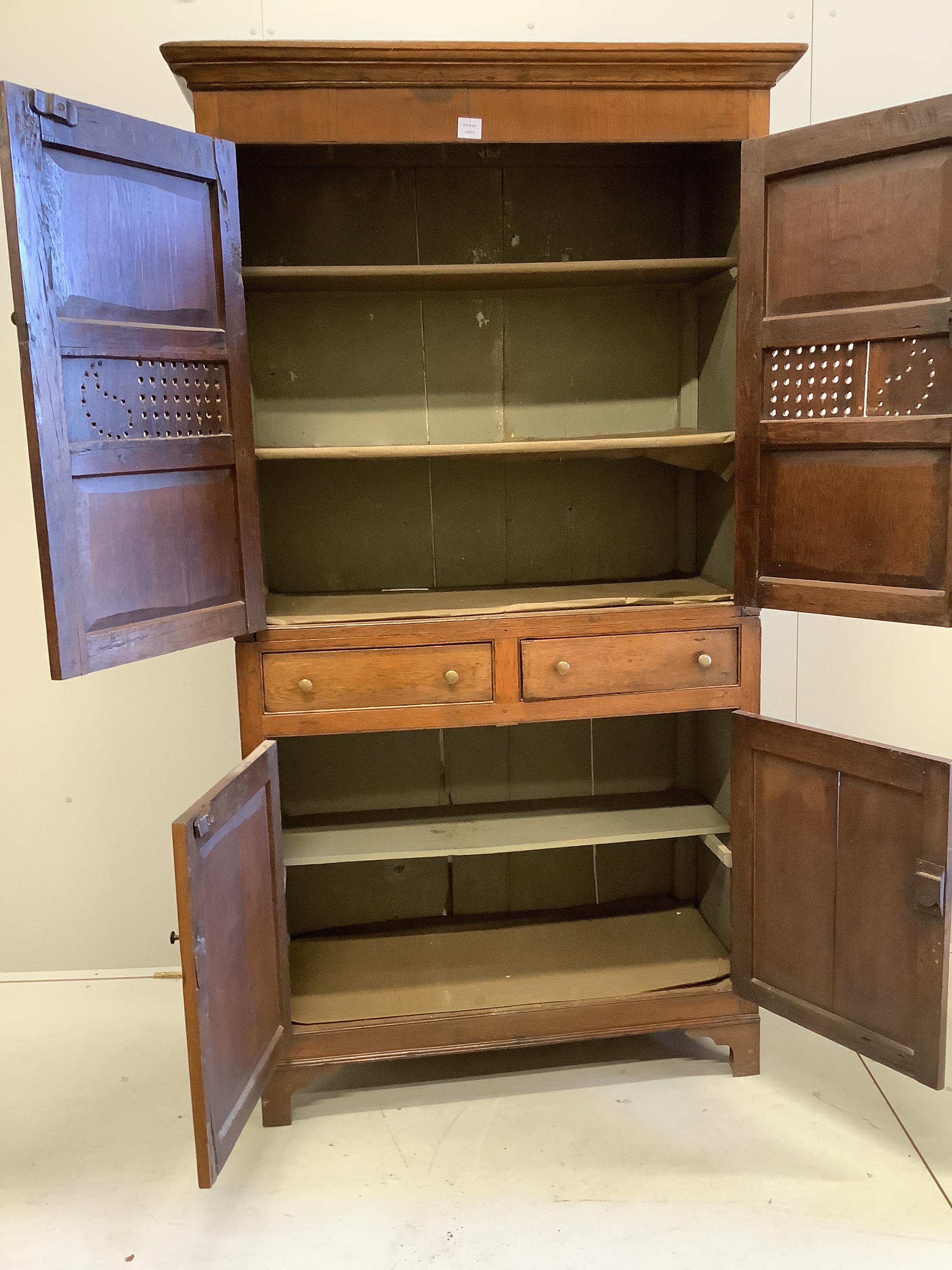 A George III Provincial oak household cabinet, width 108cm, depth 50cm, height 196cm